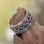 Sterling silver spinner ring, 'Knots' - Artisan Jewelry Sterling Silver Spinner Ring