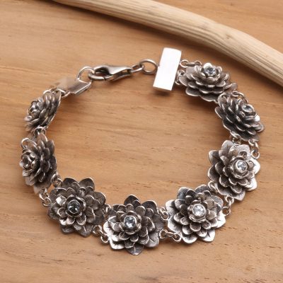 Blue topaz flower bracelet, 'Sacred Blue Lotus' - Hand Crafted Floral Sterling Silver and Blue Topaz Bracelet