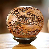 Featured review for Coconut shell sculpture, Smiling Dolphins