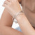 Sterling silver bangle bracelet, 'Ten Moons' - Handcrafted Sterling Silver Bangle Bracelet