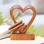 Hand Carved Suar Wood Romantic Sculpture, 'Heart Power'