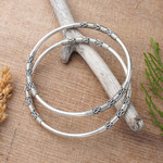 Sterling silver bangle bracelets, 'Secrets' (pair) - Artisan Crafted Sterling Silver Bangle Bracelets (Pair)