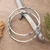Sterling silver bangle bracelets, 'Secrets' (pair) - Artisan Crafted Sterling Silver Bangle Bracelets (Pair)