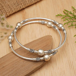 Sterling silver bangle bracelets, 'Ubud Moons' (pair) - Sterling Silver Bangle Bracelets from Indonesia (Pair)