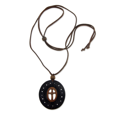 Coconut shell flower necklace, 'Cross of Life' - Handcrafted Coconut Shell Pendant Necklace