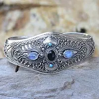 Onyx and moonstone cuff bracelet, 'Radiant Bali' - Moonstone and Onyx Silver Cuff Bracelet