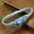 Blue topaz and peridot braided bracelet, 'Bamboo Blossoms' - Blue topaz and peridot braided bracelet thumbail