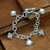 Cultured pearl charm bracelet, 'Moon Echo' - Handcrafted Sterling Silver and Pearl Charm Bracelet thumbail