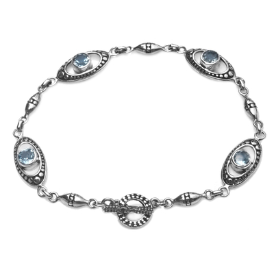 Blue topaz link bracelet, 'Reflections in Blue' - Sterling Silver and Blue Topaz Link Bracelet