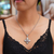 Amethyst-Blumen-Halskette, „Jasmine Wonder“ – Kreuz-Halskette aus Sterlingsilber und Amethyst