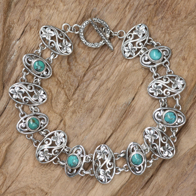 Sterling silver flower bracelet, 'Frangipani Fantasy' - Floral Sterling Silver and Reconstituted Turquoise Bracelet