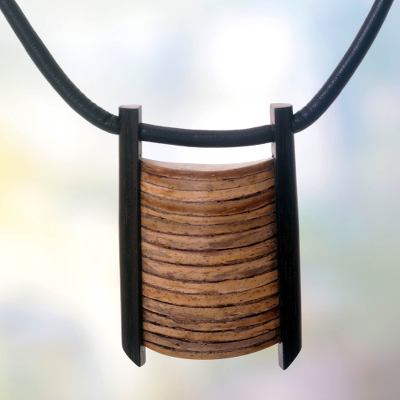 Ebony and coconut shell pendant necklace, 'Whispering Palm' - Ebony and coconut shell pendant necklace