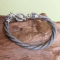 Men's sterling silver bracelet, 'Naga Twist' - Handcrafted Men's Silver Braided Bracelet from Indonesia