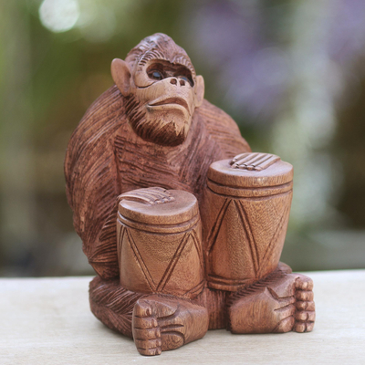 Wood statuette, 'Orangutan Plays the Jambe' - Handcrafted Wood Sculpture from Bali
