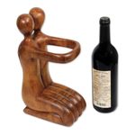 Wood wine bottle holder, 'Gift of Love' - Balinese Hand Carved Romantic Wine Bottle Holder