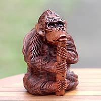 Wood statuette, Orangutan Plays the Flute