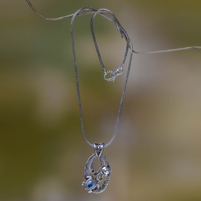 Blue topaz pendant necklace, 'Mother Sea Turtle' - Silver and Blue Topaz Turtle Necklace