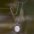 Bone and amethyst pendant necklace, 'Phoenix Rose' - Sterling Silver Necklace with Bone and Amethyst Medallion