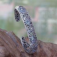 Blue topaz cuff bracelet, 'Dancing Swans' - Blue Topaz and Sterling Silver Cuff Bracelet from Bali