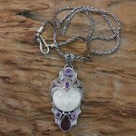 Amethyst and bone pendant necklace, 'Candra Kirana' - Carved Bone and Amethyst Necklace from Bali