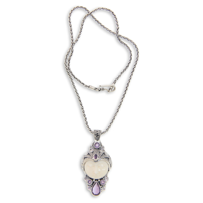 Amethyst and bone pendant necklace, 'Candra Kirana' - Carved Bone and Amethyst Necklace from Bali