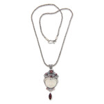 Carved pendant necklace with Garnet, 'Layonsari' - Carved Pendant Necklace with Garnet from Bali
