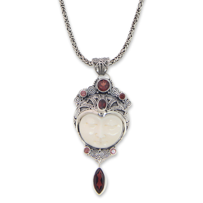 Carved pendant necklace with Garnet, 'Layonsari' - Carved Pendant Necklace with Garnet from Bali