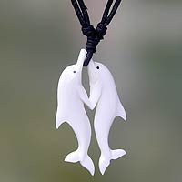 Bone pendant necklace, 'Twin Dolphins' - Carved Cow Bone Dolphin Themed Pendant Necklace