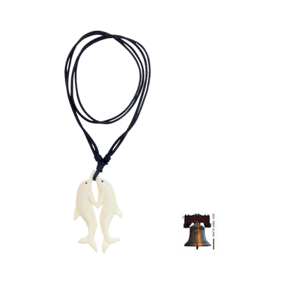 Bone pendant necklace, 'Twin Dolphins' - Carved Cow Bone Dolphin Themed Pendant Necklace