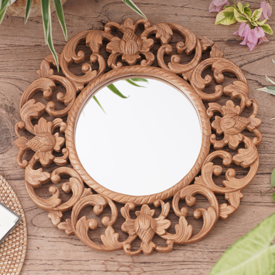 Wood wall mirror, 'Balsamina Buds' - Round Floral Carved Suar Wood Wall Mirror from Bali