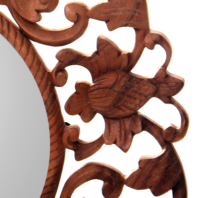 Wood wall mirror, 'Balsamina Buds' - Round Floral Carved Suar Wood Wall Mirror from Bali