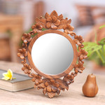 Wood framed wall mirror, 'Gianyar Moon' - Hand Carved Wood Round Floral Wall Mirror from Bali