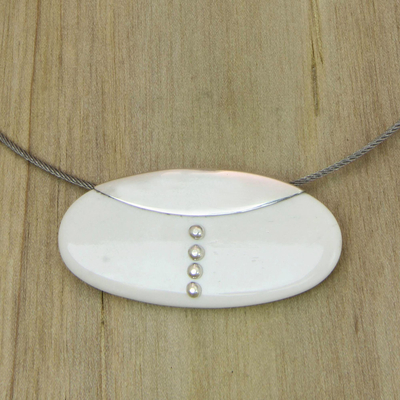 Bone and sterling silver pendant necklace, 'Clutch' - Modern Bone and Silver Necklace on Stainless Steel Cord