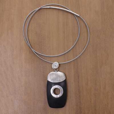 Ebony wood pendant necklace, 'Tonga Tornado' - Ebony Sterling Silver Pendant on Stainless Steel Necklace