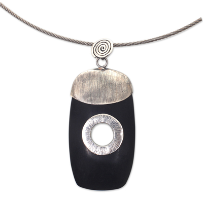 Ebony wood pendant necklace, 'Tonga Tornado' - Ebony Sterling Silver Pendant on Stainless Steel Necklace