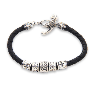 Braided leather bracelet, 'Angel of Nature in Black' - Black Braided Leather Bracelet with Sterling Silver Pendants