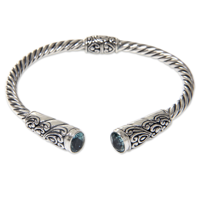 Blue topaz cuff bracelet, 'Beacon of Light' - Blue Topaz on Sterling Silver Hinged Cuff Bracelet from Bali