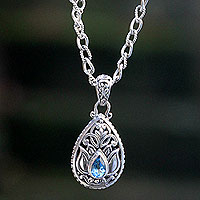 Blue topaz pendant necklace, 'Padma Lotus' - Artisan Crafted Floral Silver Necklace with Blue Topaz