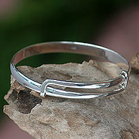 Sterling silver bangle bracelet, 'Tender Embrace' - Balinese Handcrafted Sterling Silver Bangle Bracelet