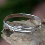 Sterling silver bangle bracelet, 'Tender Embrace' - Balinese Handcrafted Sterling Silver Bangle Bracelet