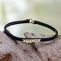 Leather wristband bracelet, 'Breathe' - Engraved Brass on Slender Leather Wristband Bracelet