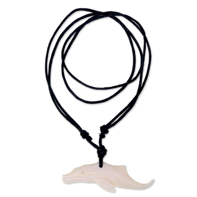 Bone pendant necklace, 'Handsome Whale' - Carved Whale Cow Bone Pendant on Black Cotton Necklace