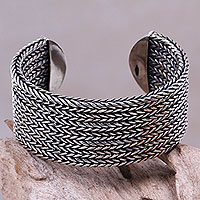 Sterling silver cuff bracelet, 'Horseshoe Braids' - Artisan Sterling Silver Cuff of oxidised Braids with Highly 