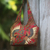 Beaded cotton batik shoulder bag, 'Red Sawunggaling' - Red Cotton Batik Beaded Shoulder Bag from Bali thumbail