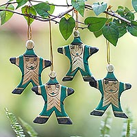 Wood ornaments, 'Happy Green Santa' (set of 4) - 4 Hand Carved Wood Christmas Ornaments with Santa Theme