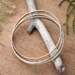 Sterling silver bangle bracelet, 'Sterling Circles' - Balinese Women's Sterling Silver Bangle Bracelet