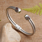Garnet and peridot cuff bracelet, 'Flower Buds' - Braided Sterling Silver Cuff with Peridot and Garnet Gems