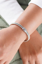 Garnet and peridot cuff bracelet, 'Flower Buds' - Braided Sterling Silver Cuff with Peridot and Garnet Gems