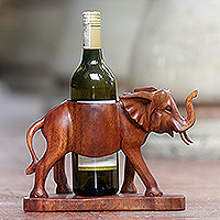 Wood wine bottle holder, 'Sumatran Elephant' - Hand Carved Suar Wood Elephant Wine Bottle Holder