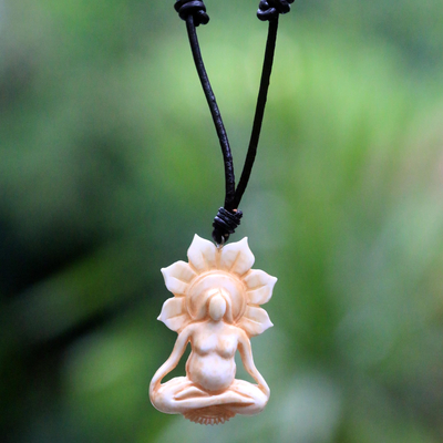 Bone and leather pendant necklace, 'Peace Before Birth' - Hand Carved Bone and Leather Mother Necklace from Bali
